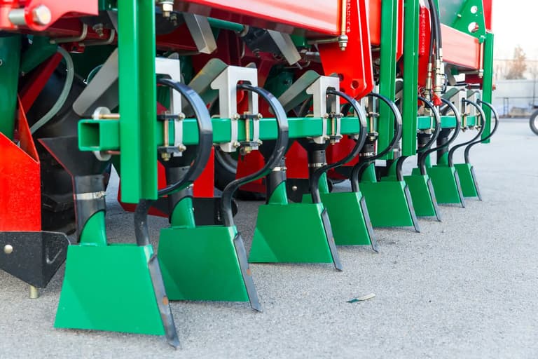 trenching and fertilizing component of a potato planter